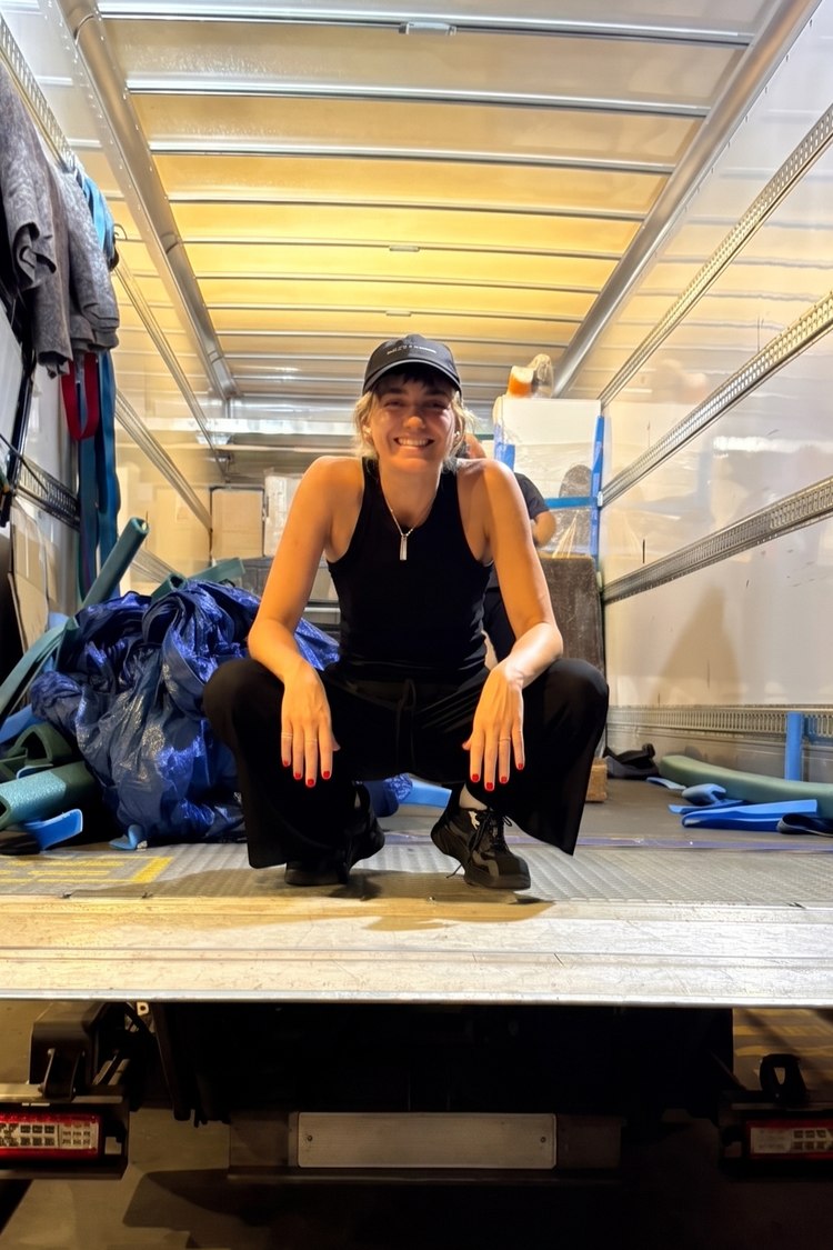 Laura on site in a delivery lorry, managing event setup